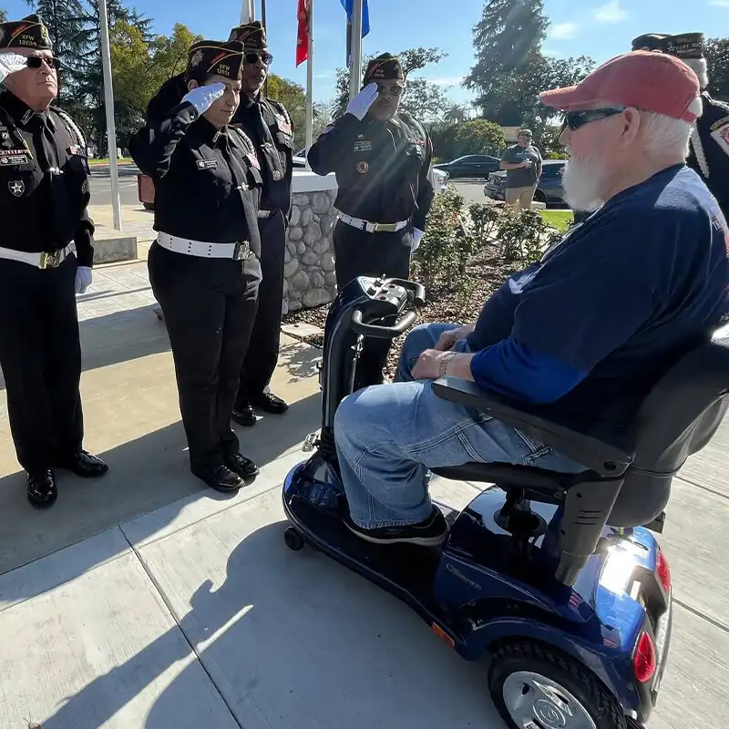 JohnMcLee-veteran-riding-new-electric-scooter John McLee, a veteran riding his new electric scooter provided by Wheels for Warriors.